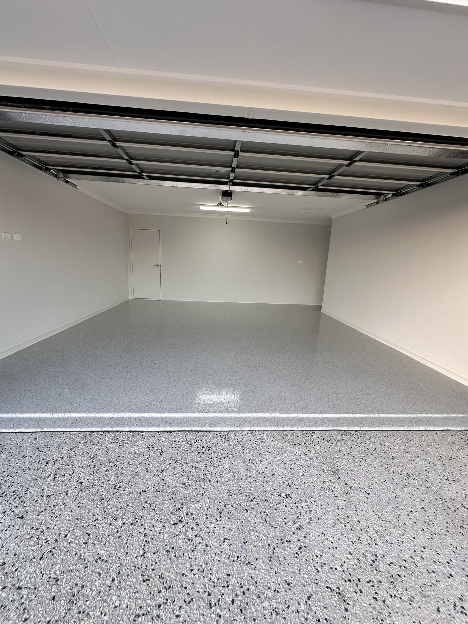 Pebble small flake epoxy garage floor with gloss clear top coat, Yarrabilba