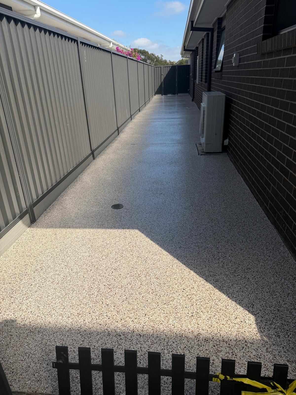 Flake epoxy side path with floor drain and air conditioner pad, Thornlands
