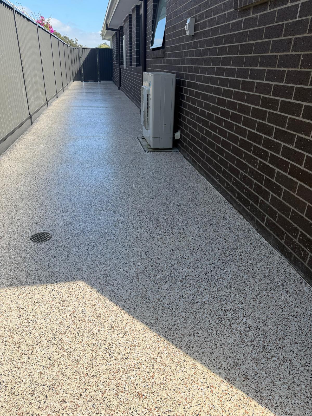 Anti-slip flake floor coating on side path of a Thornlands home