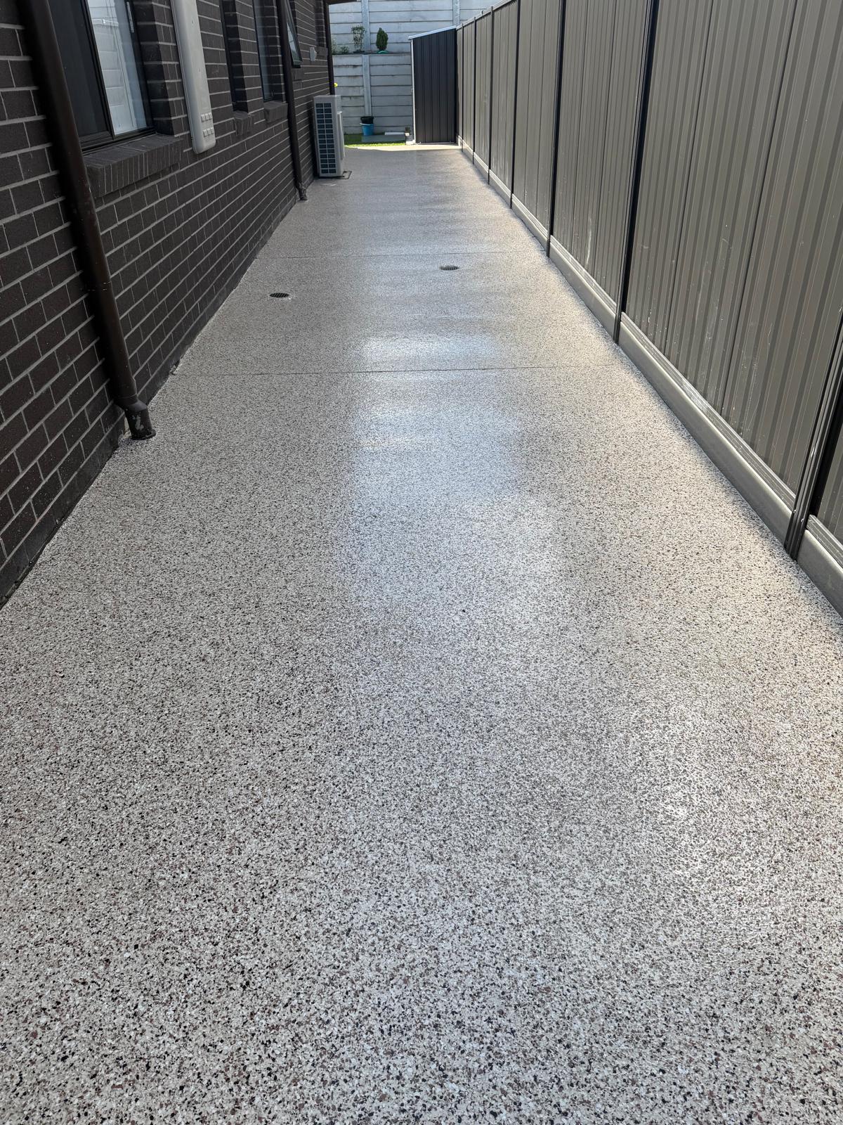 Anti-slip flake coating on front patio with outdoor table and chairs